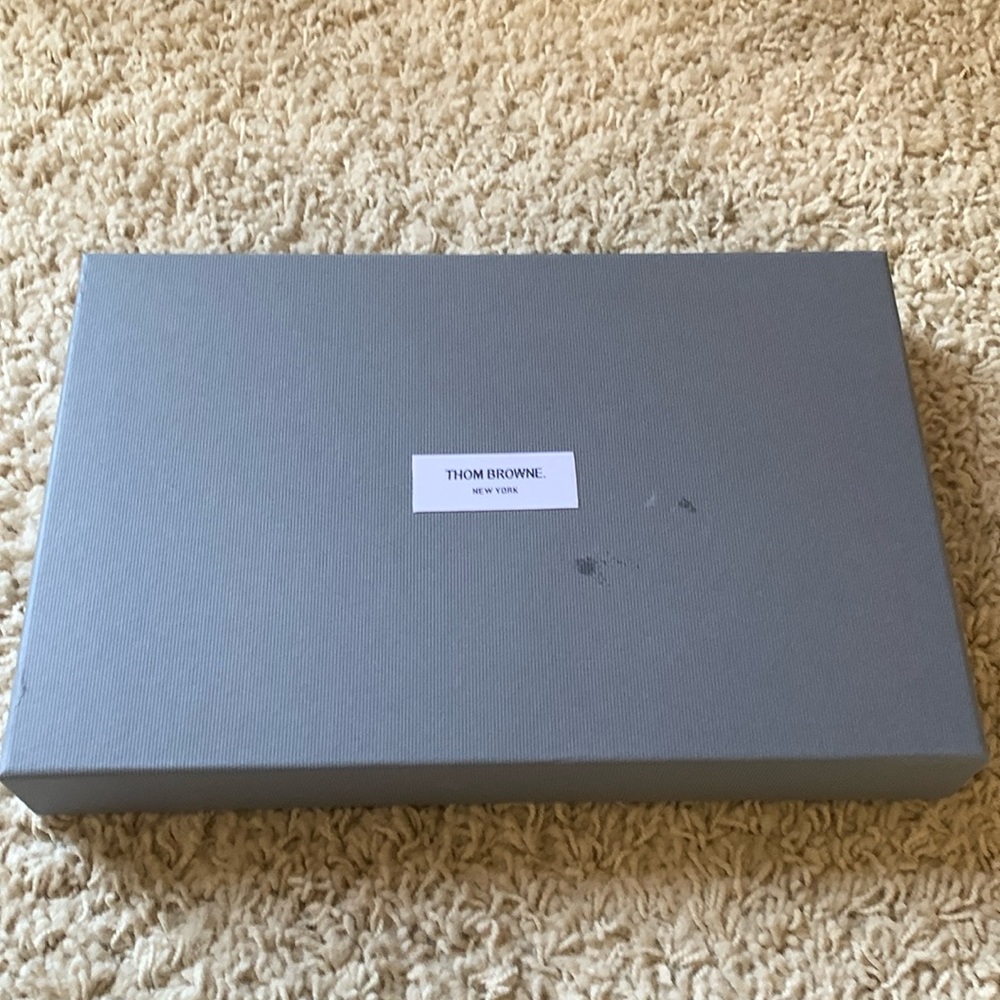 Thom Browne box.  13 3/4”x9”. 1 3/4” Deep.  Good condition stain on top of box